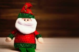 Photo of a plush santa claus toy.